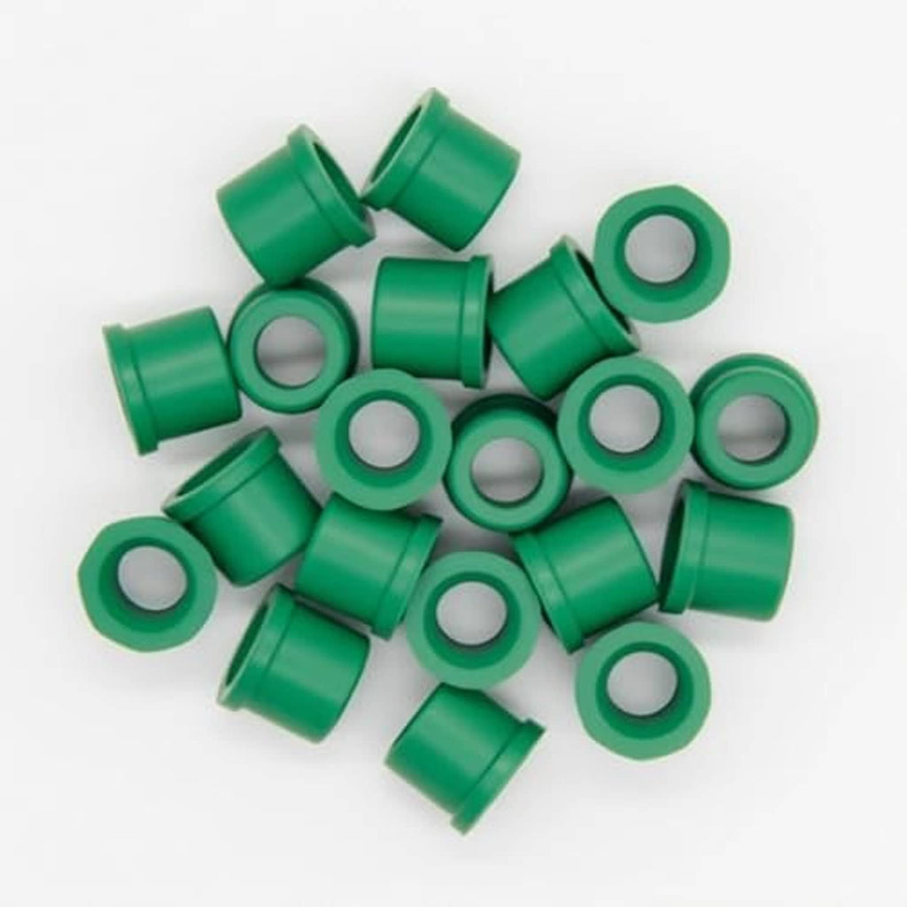 Pile of green rubber hose gaskets with white inner seal holes