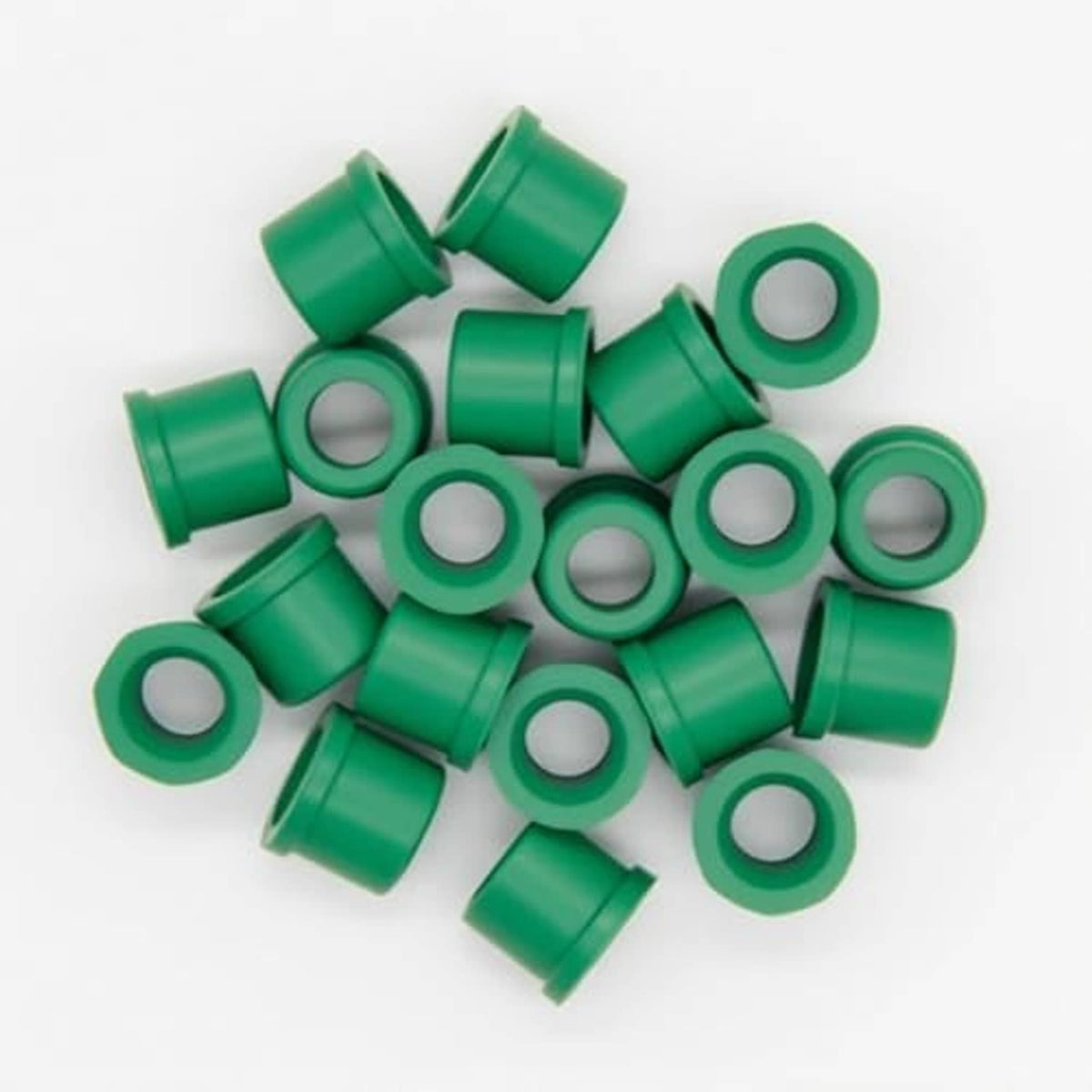 Pile of green rubber hose gaskets with white inner seal holes