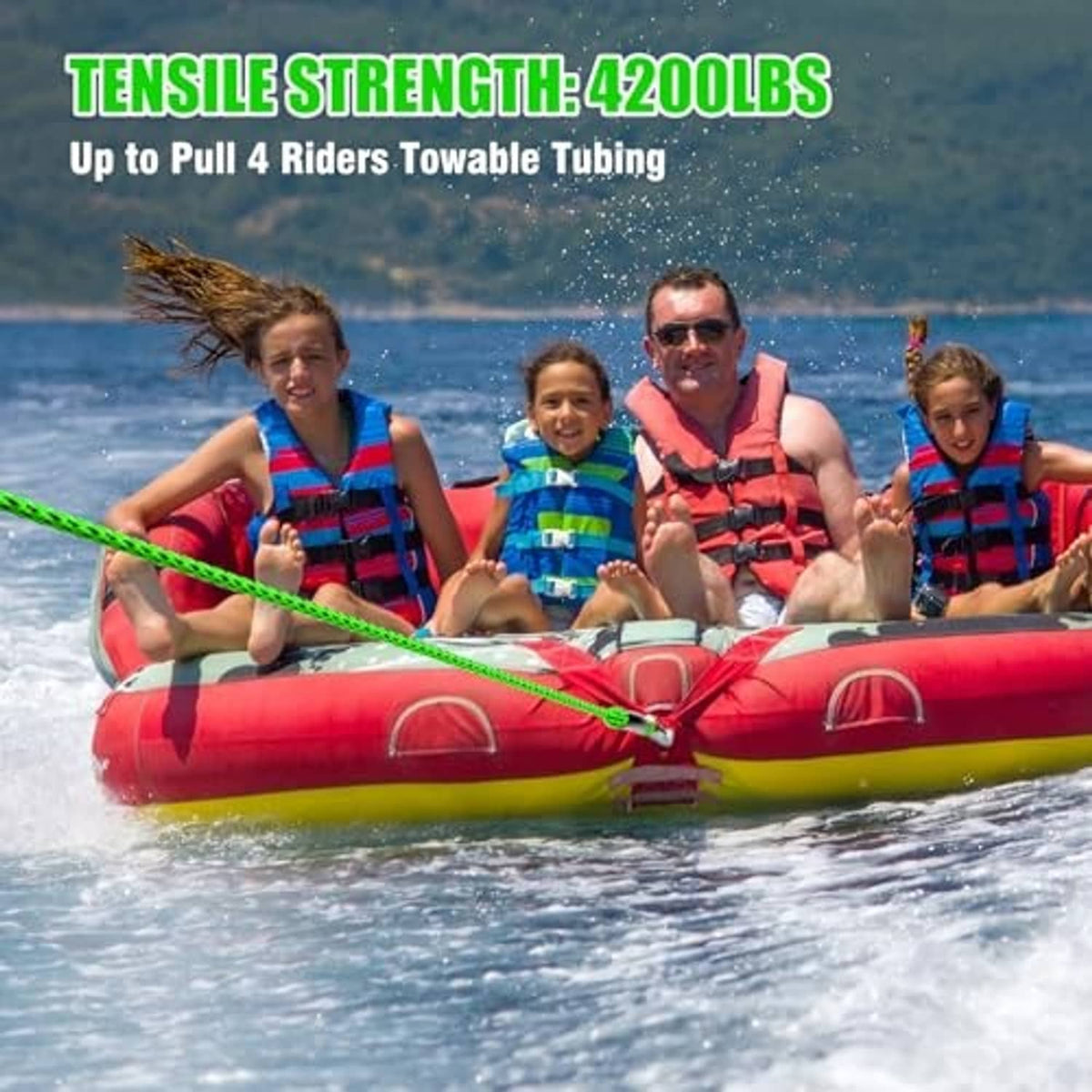 Green tow rope tied across a red inflatable tubing raft with riders onboard