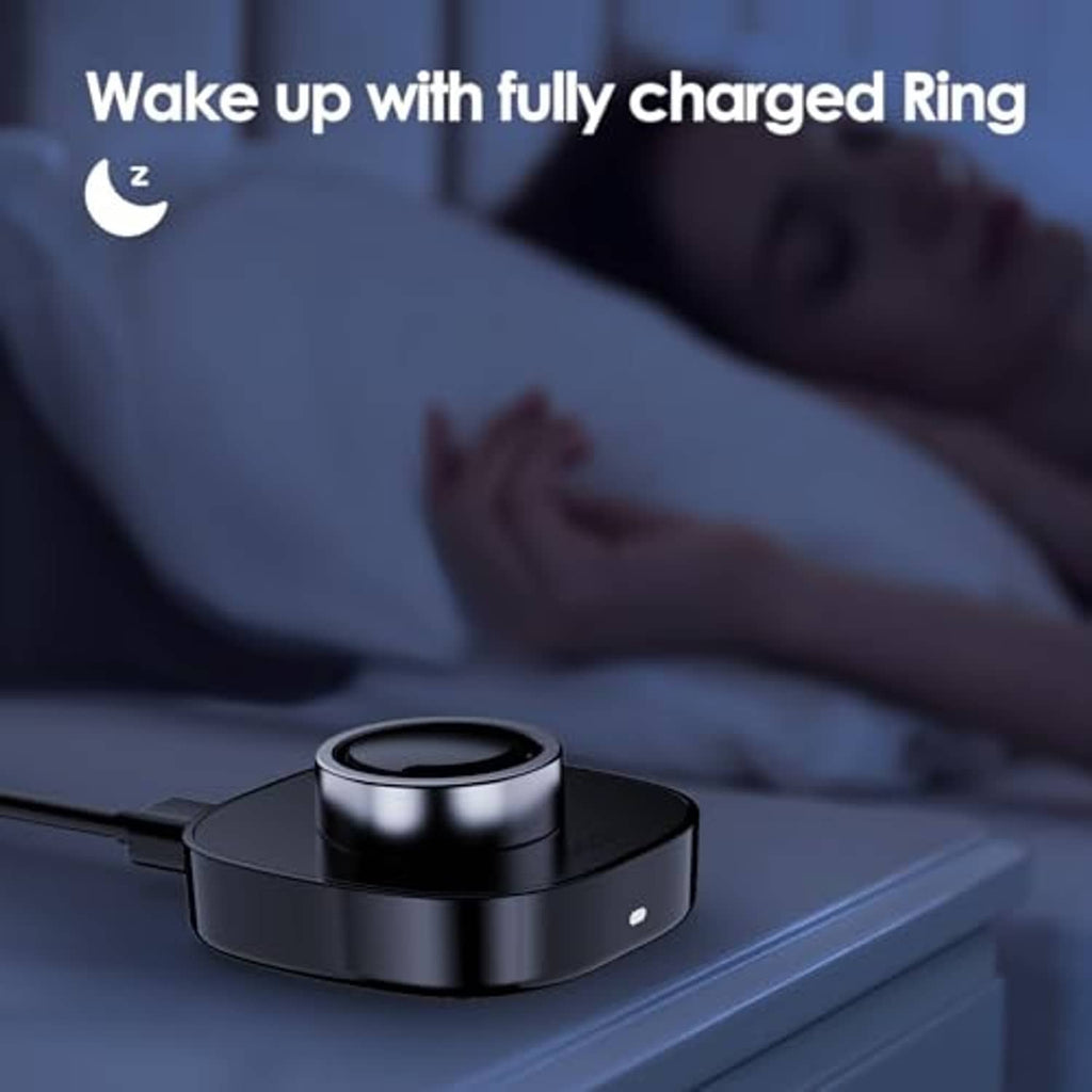 Black charging dock on bedside surface with centered ring holder