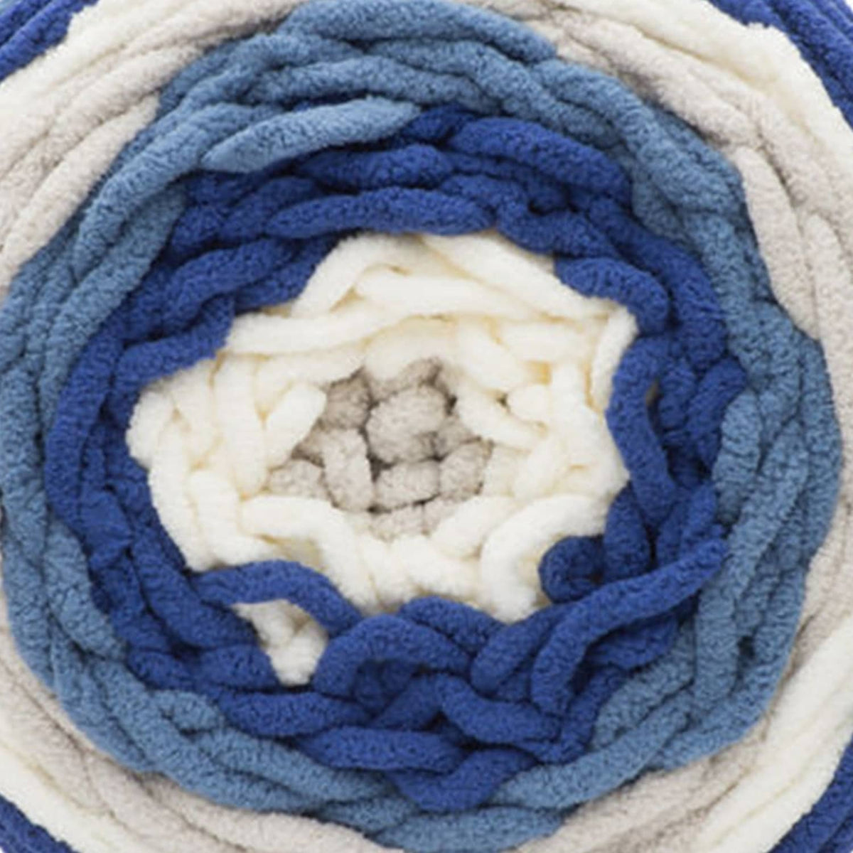 Close-up of blue and cream self-striping yarn ball and textured loops
