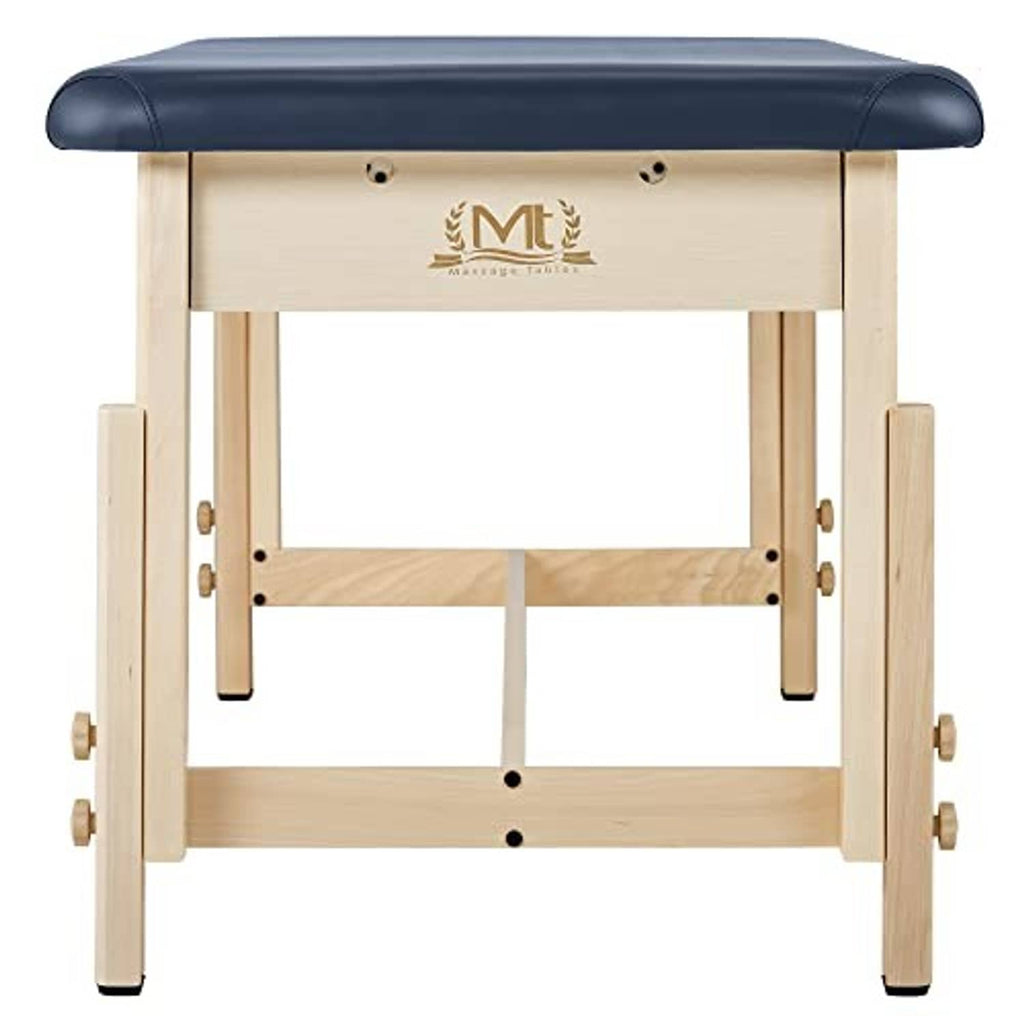 Stationary treatment table front view with dark blue padded top and wood legs