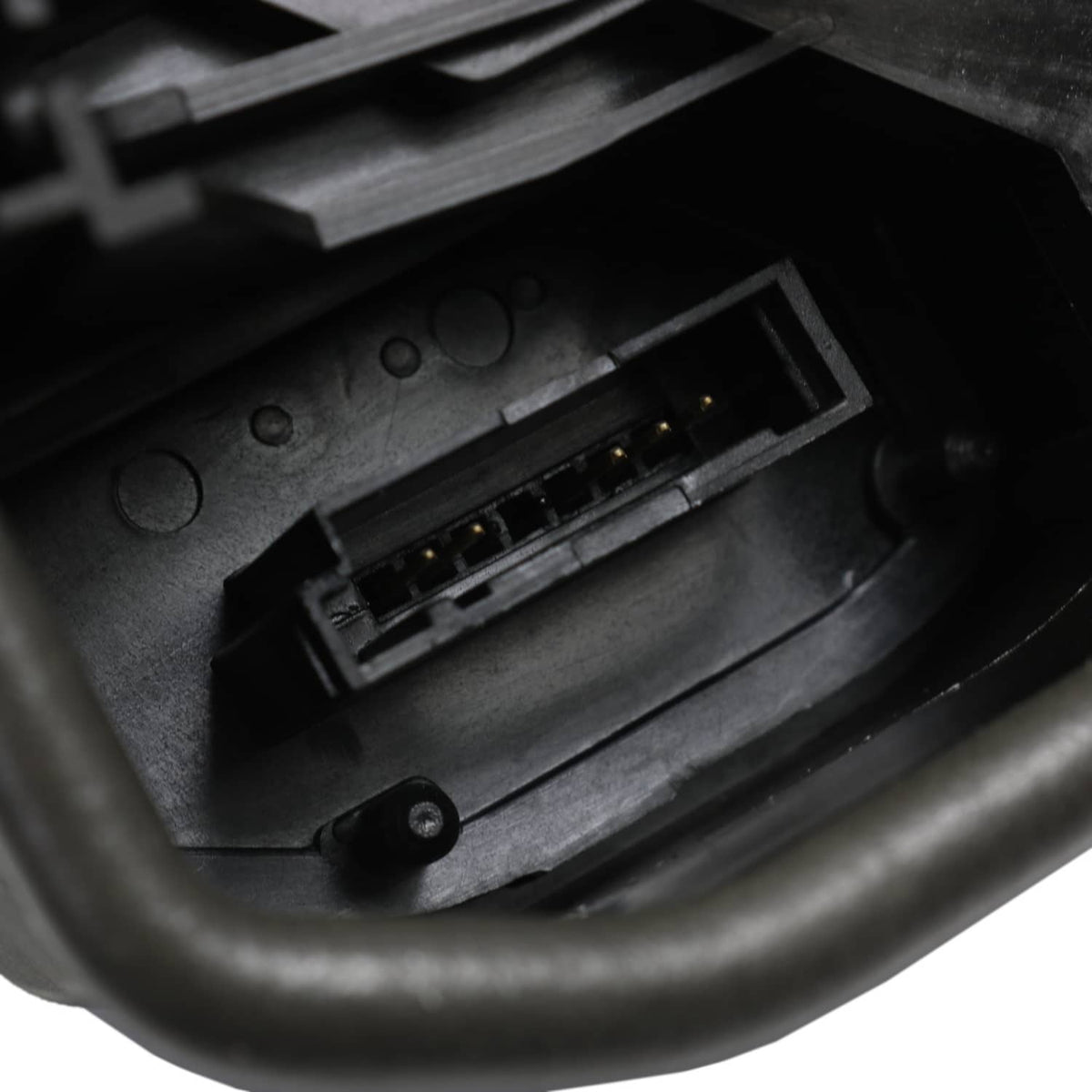 Close-up of power door lock actuator connector inside the black housing