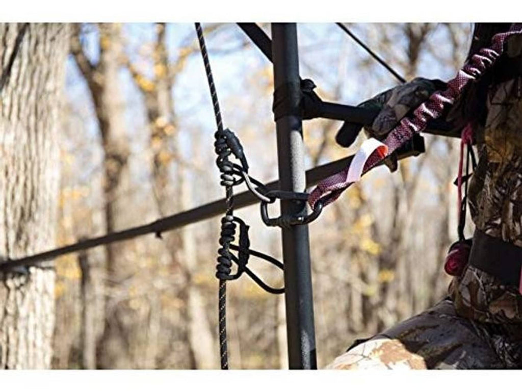 Black rope safety line looped on pole with metal attachment rings
