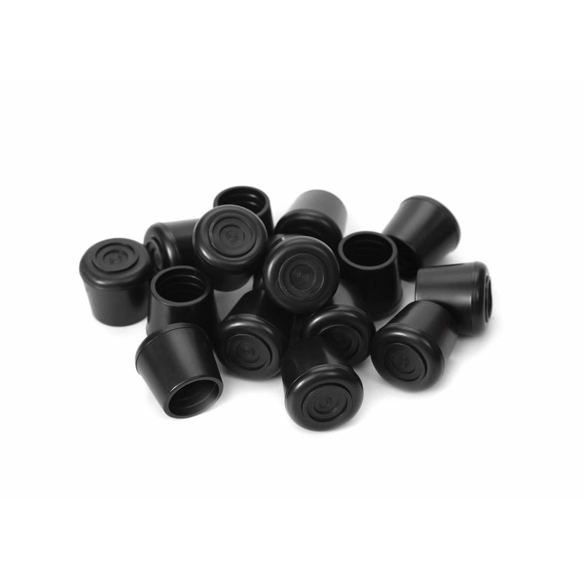 Black round rubber chair leg caps in a pile, open bottom sleeves with grip texture