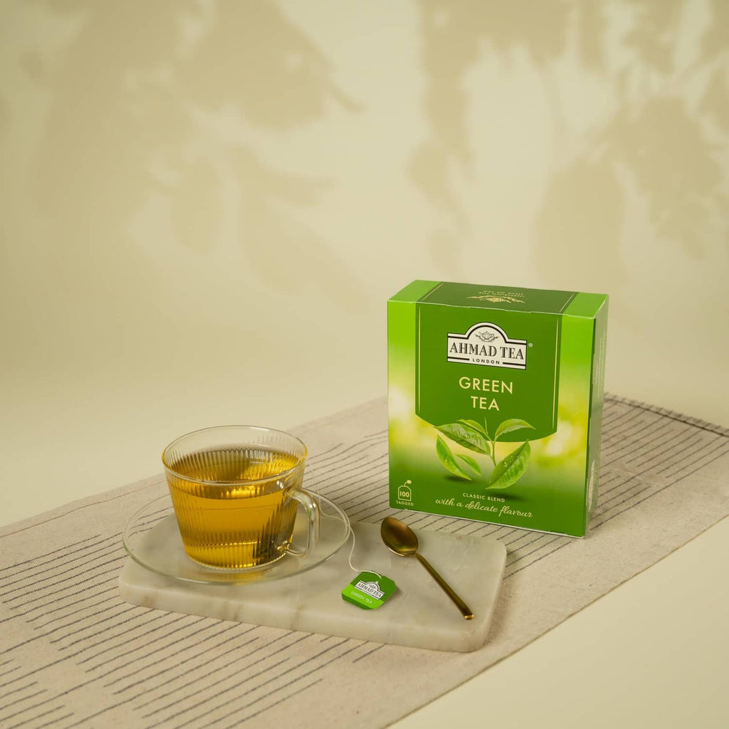 Ahmad Tea Green Tea box with a glass cup and small green tea sachet