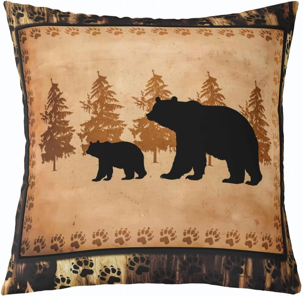 Tan throw pillow cover with black bear and paw print border, woodland silhouette design