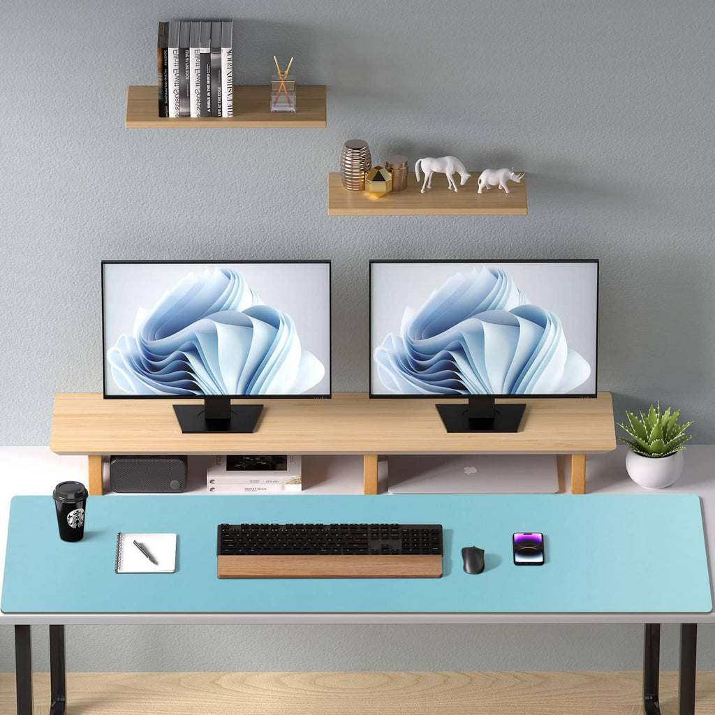 Blue topaz desk pad protector centered on a computer desk