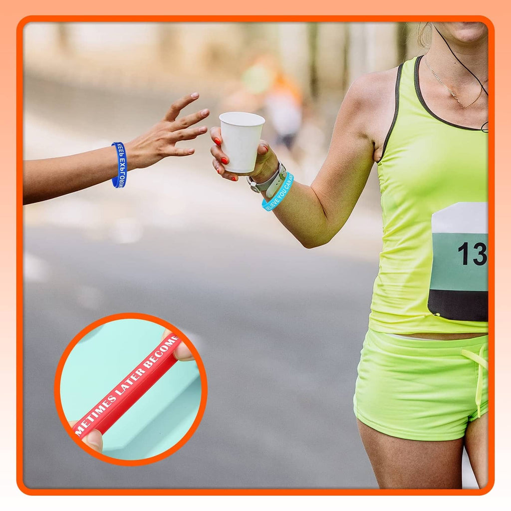 Multicolor motivational silicone wristband on a runner’s wrist, red and blue