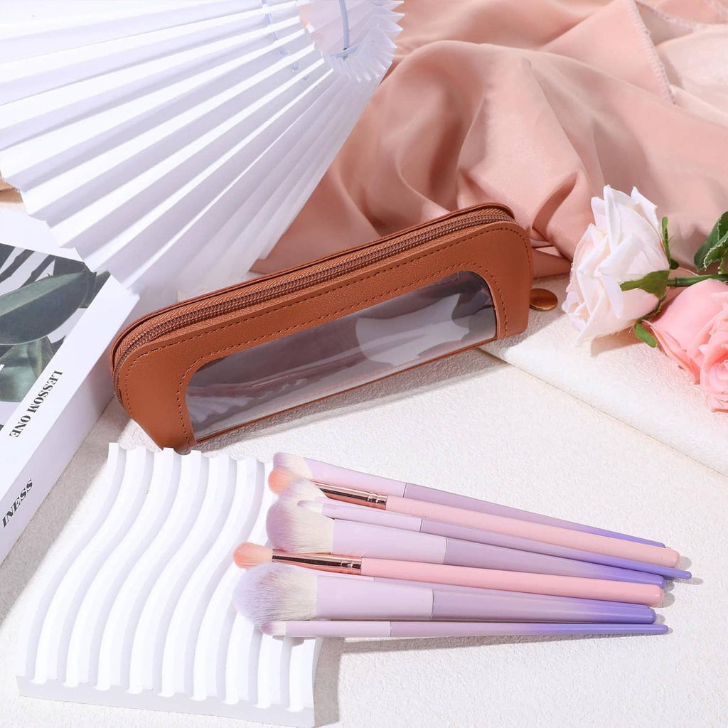 Brown PU clear makeup pouch with zipper, containing makeup brushes and tools inside