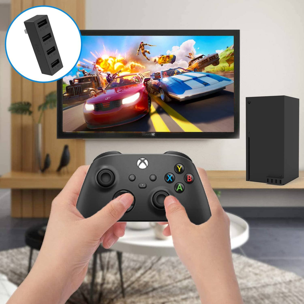 Black 4-port USB hub connected near a game controller and TV setup