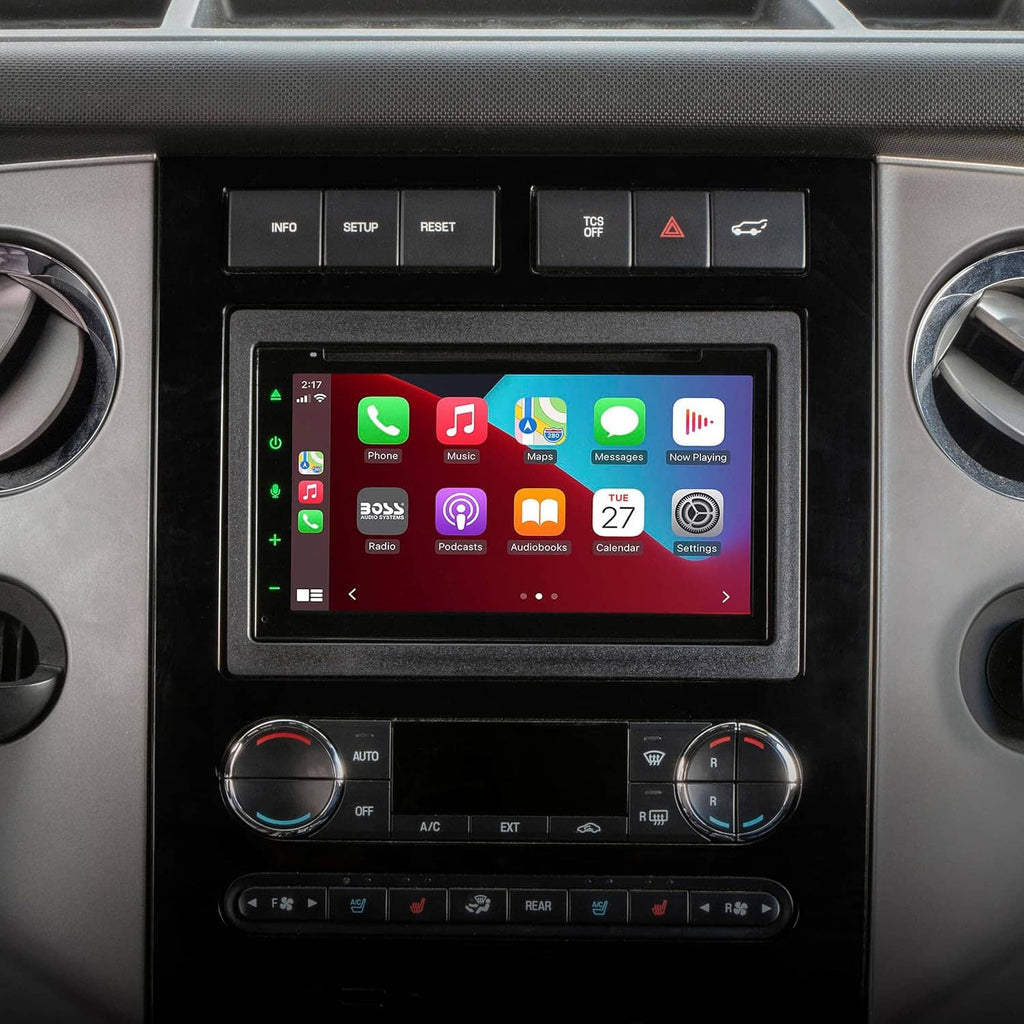 Double DIN radio dash bezel installed in car dashboard with touchscreen and control knobs
