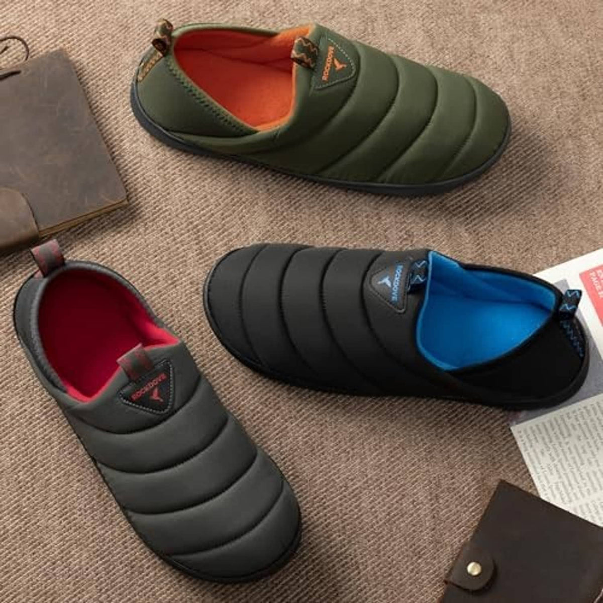 Men's dark grey quilted loafer slipper with red lining, shown with open toe view.