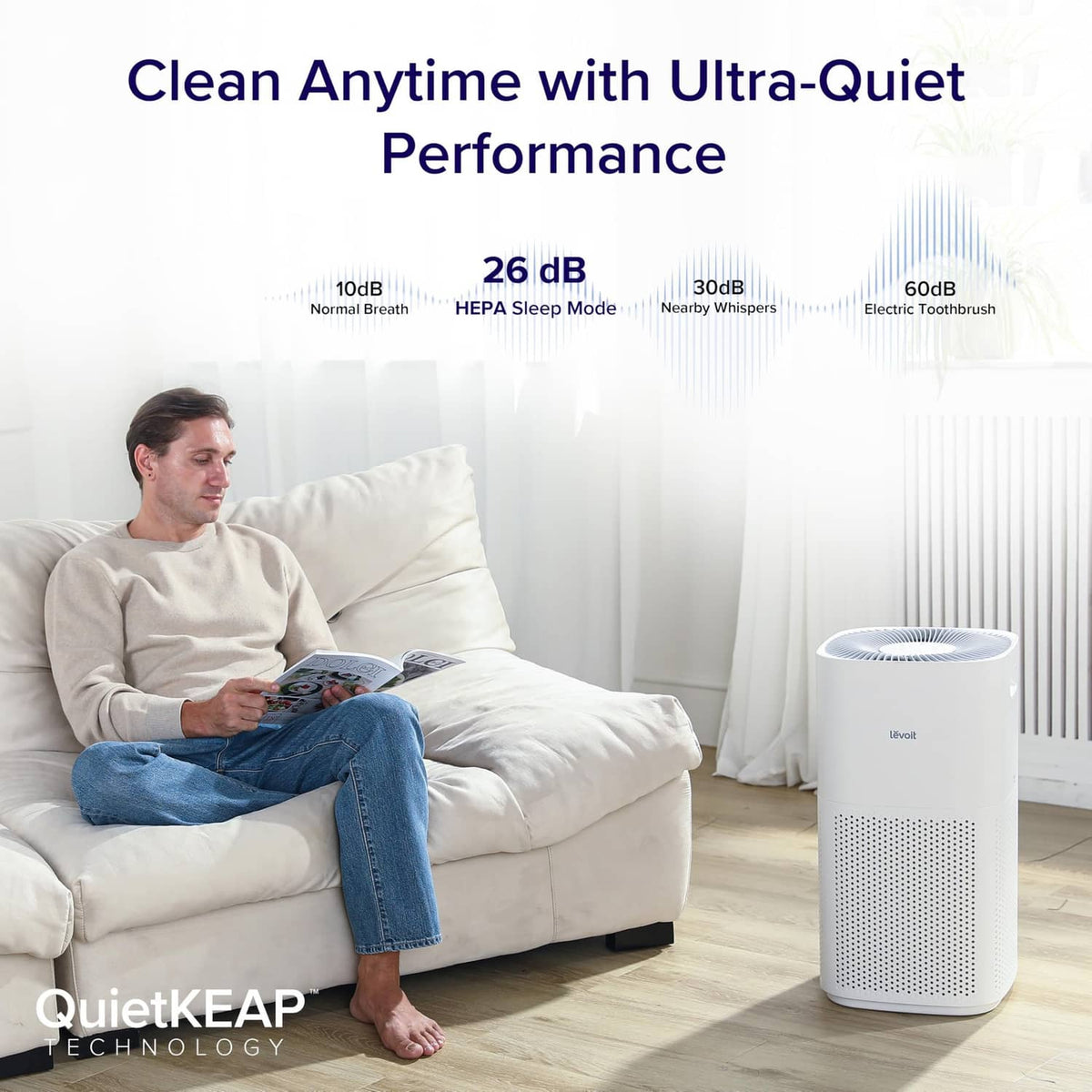 White Levoit air purifier on the floor with perforated front and top vents