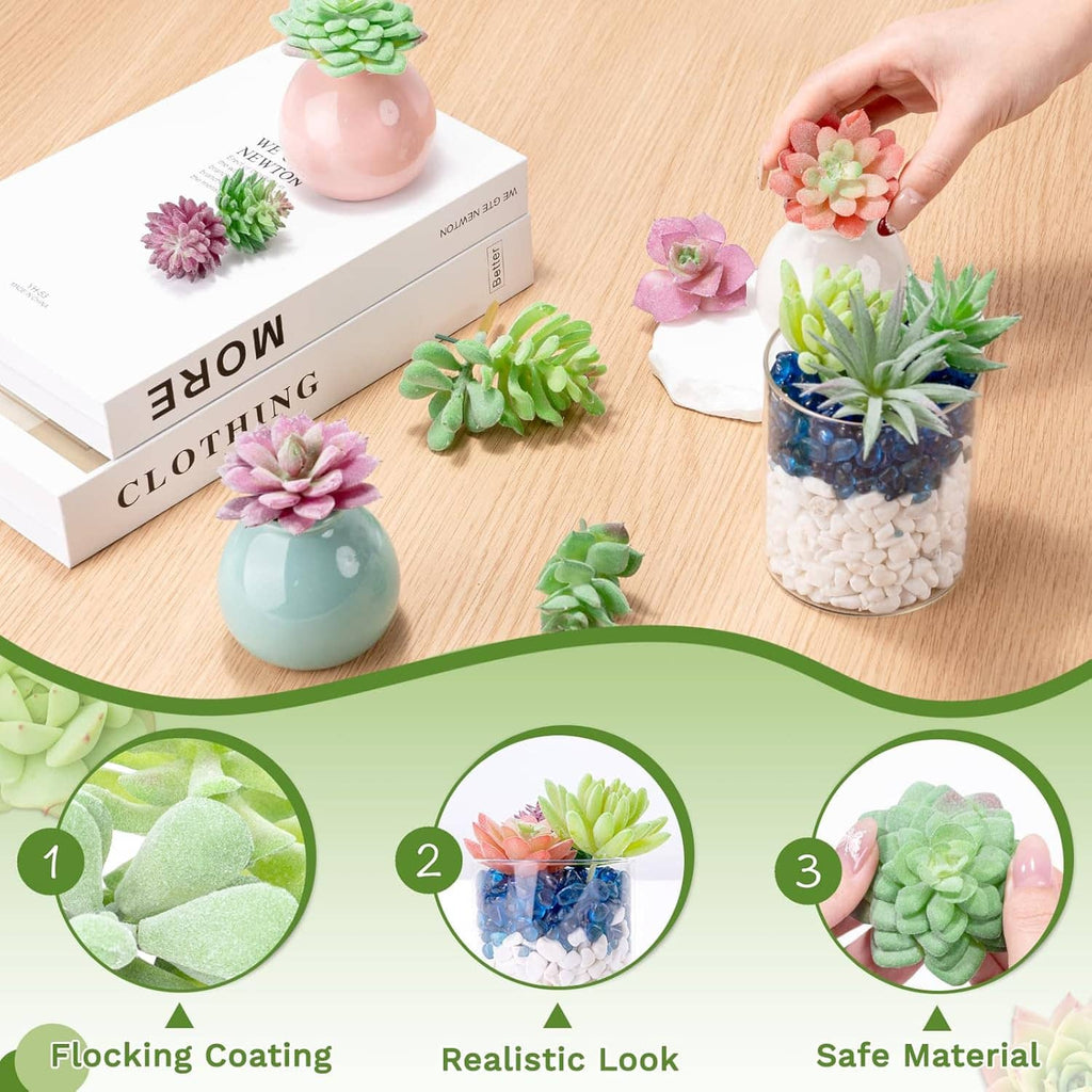 Assorted mini artificial succulents in small pots arranged on a tabletop.