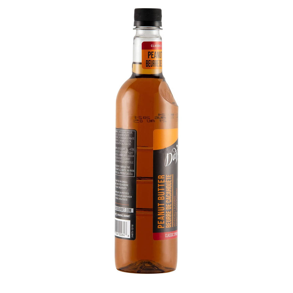 Peanut butter flavored syrup bottle with label and black cap, side view