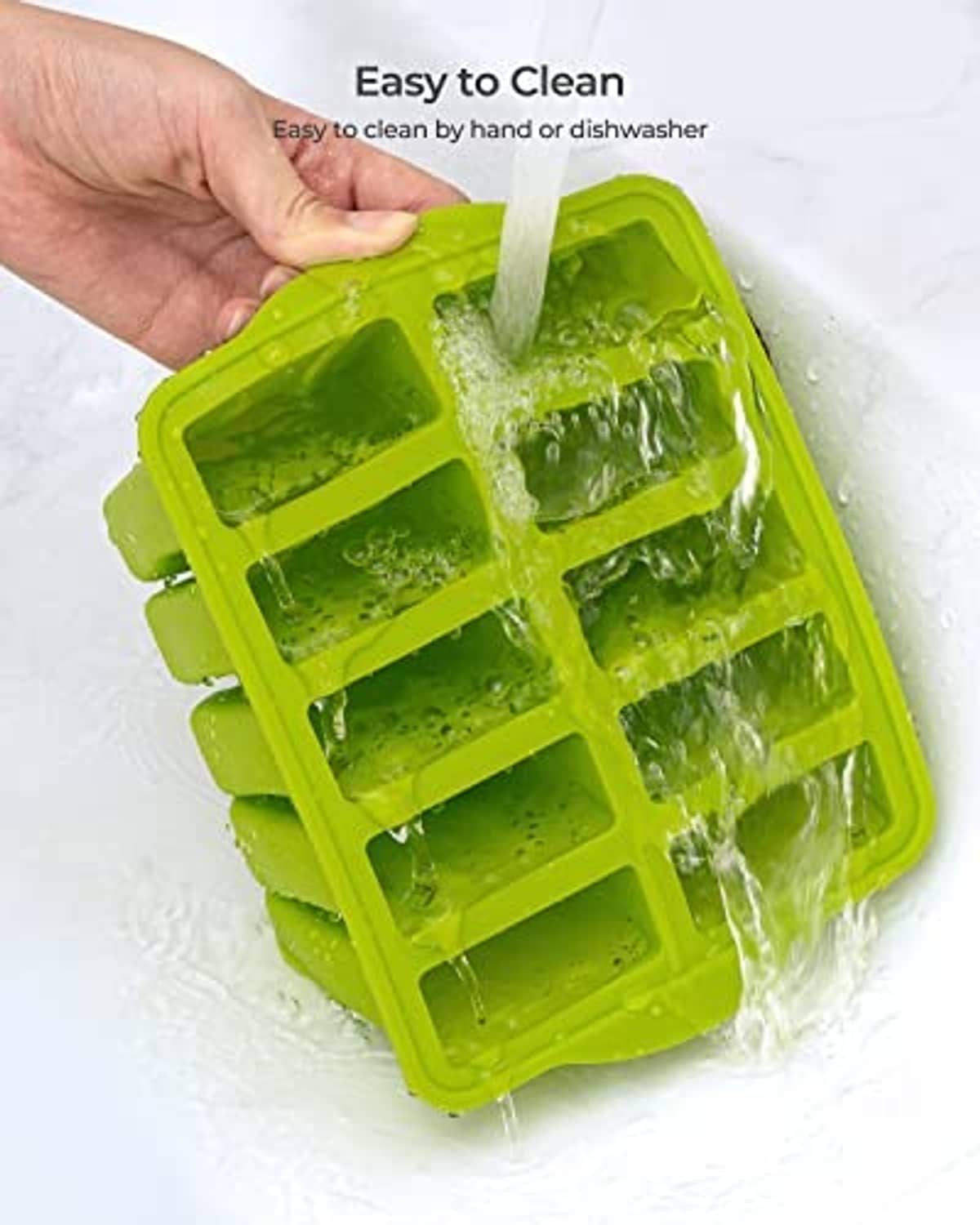 Green silicone popsicle mold being rinsed under water for easy cleaning