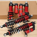 Red and black front and rear shock absorber set with coil springs and mounting eyelets