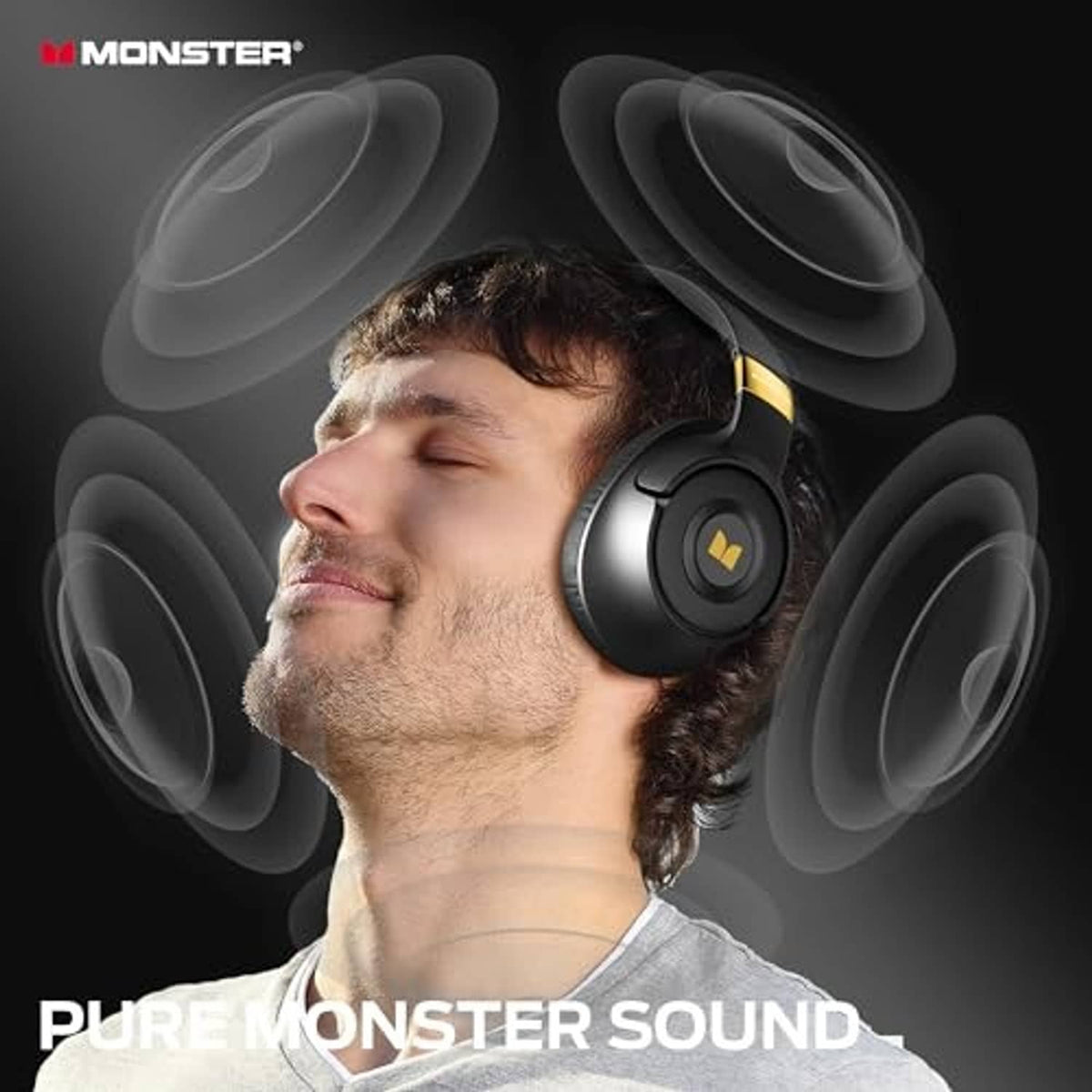 Black over-ear headphones worn over ears with gold-accent headband