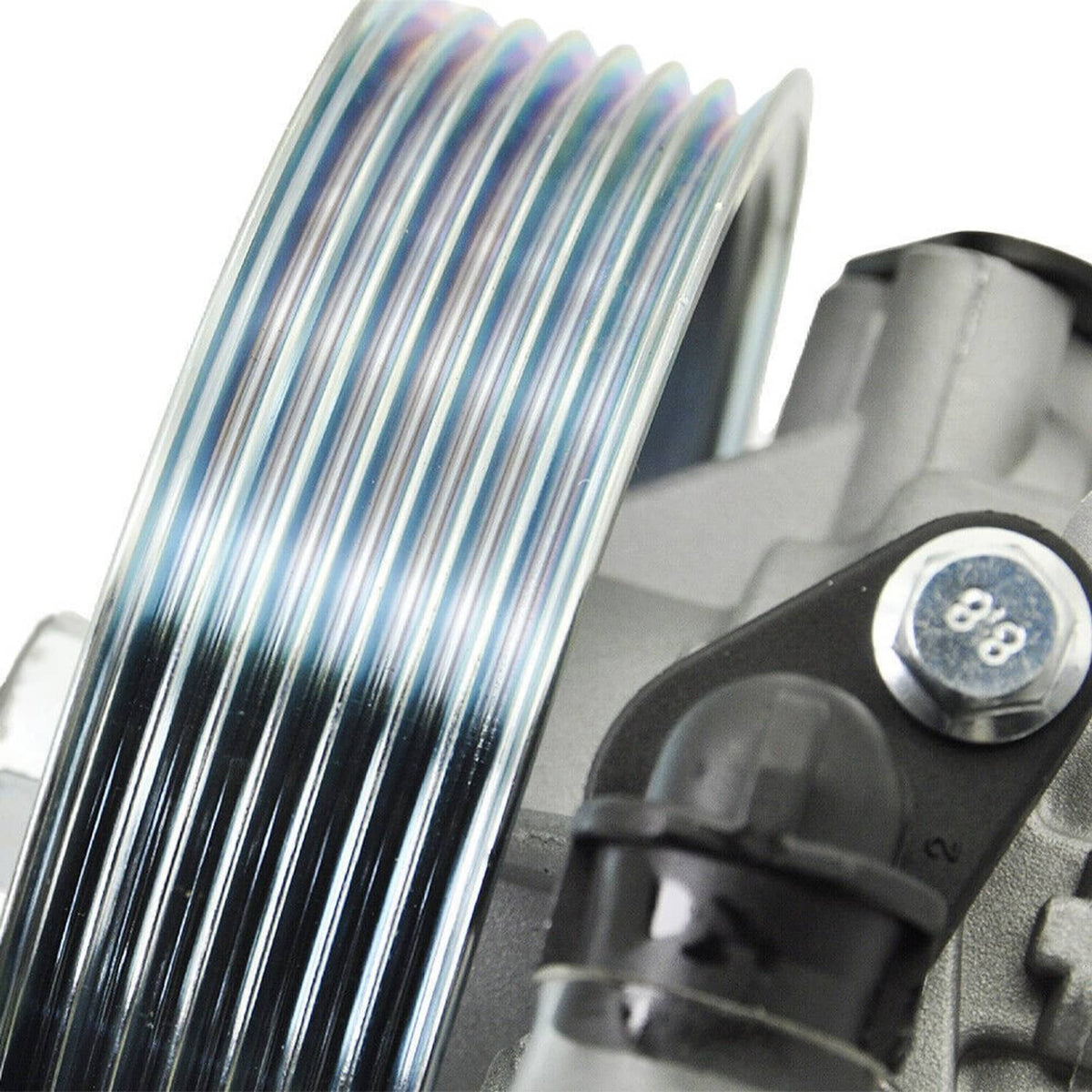 Power steering pump with metal pulley and mounting bracket, close-up