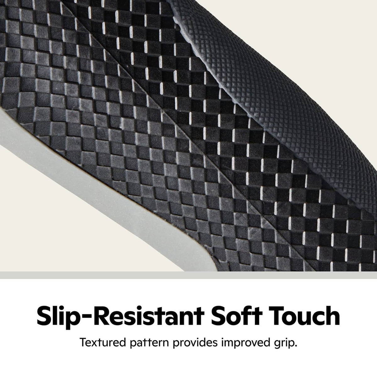 Close-up of black textured bike grip surface with raised checkered pattern