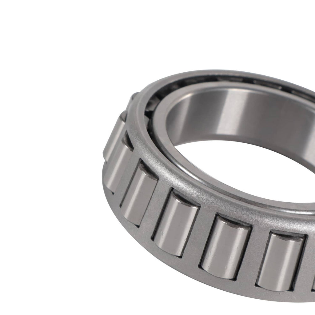 Trailer bearing kit close-up: silver bearing race edge with black roller cage segments