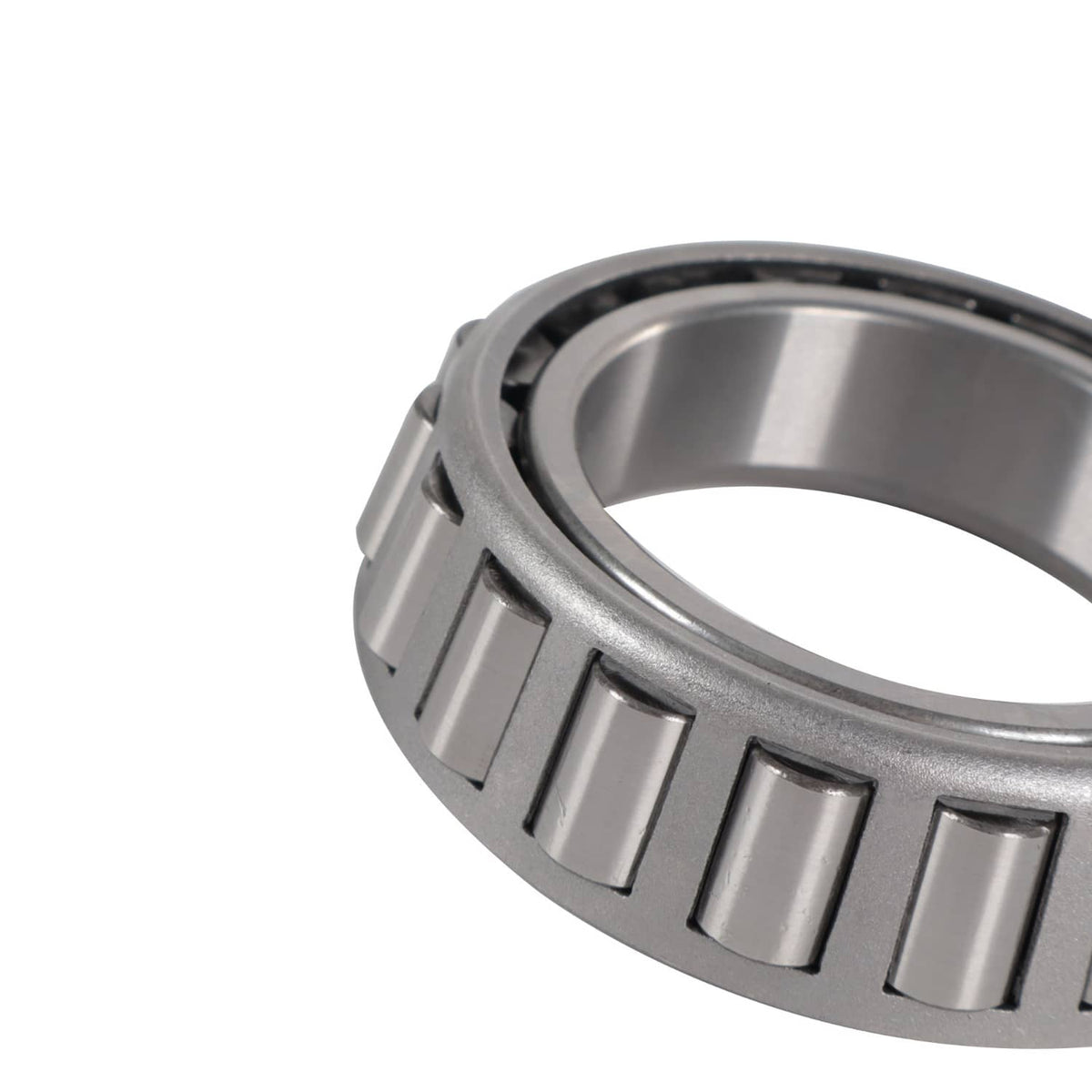 Trailer bearing kit close-up: silver bearing race edge with black roller cage segments