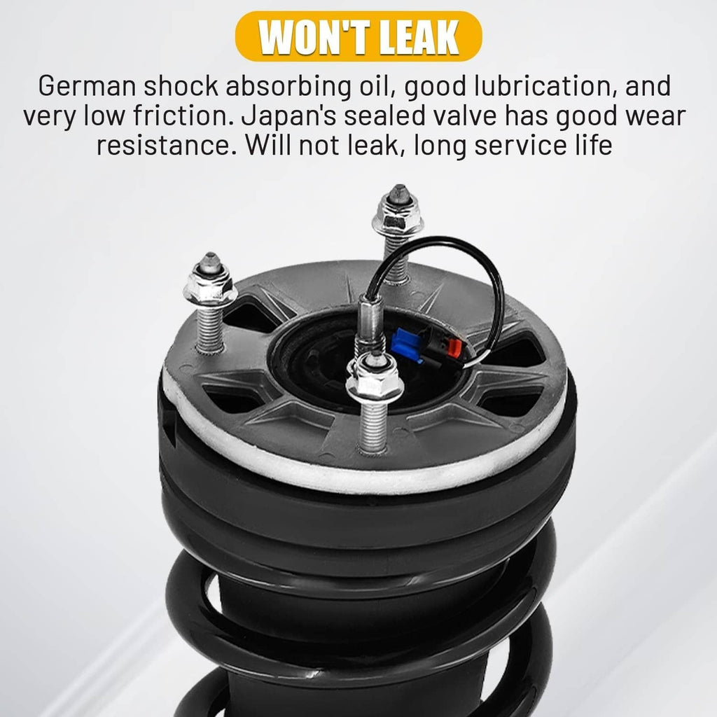 Black shock absorber strut spring with top cap and valve assembly, close-up