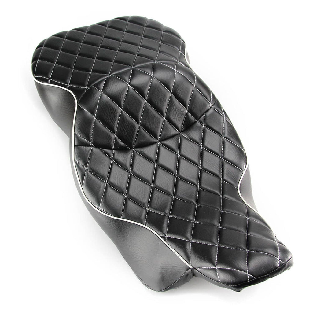 Black motorcycle seat with diamond quilt stitching and curved rider backrest