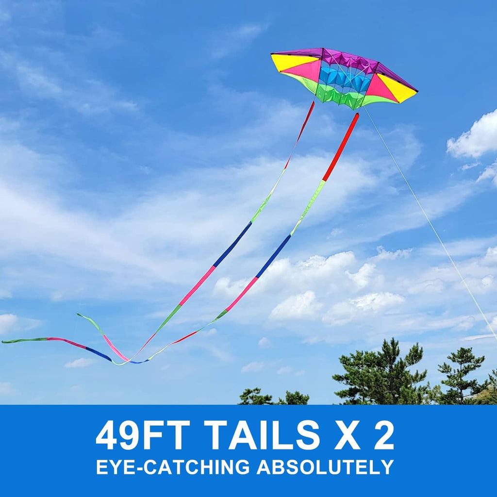 Rainbow diamond beach kite flying with two long streamer tails and lines