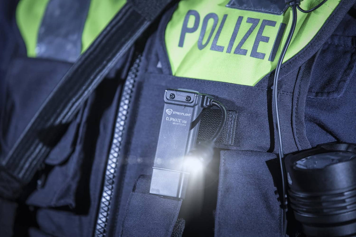 ClipMate light mounted on tactical vest with bright beam, visible switch and cable