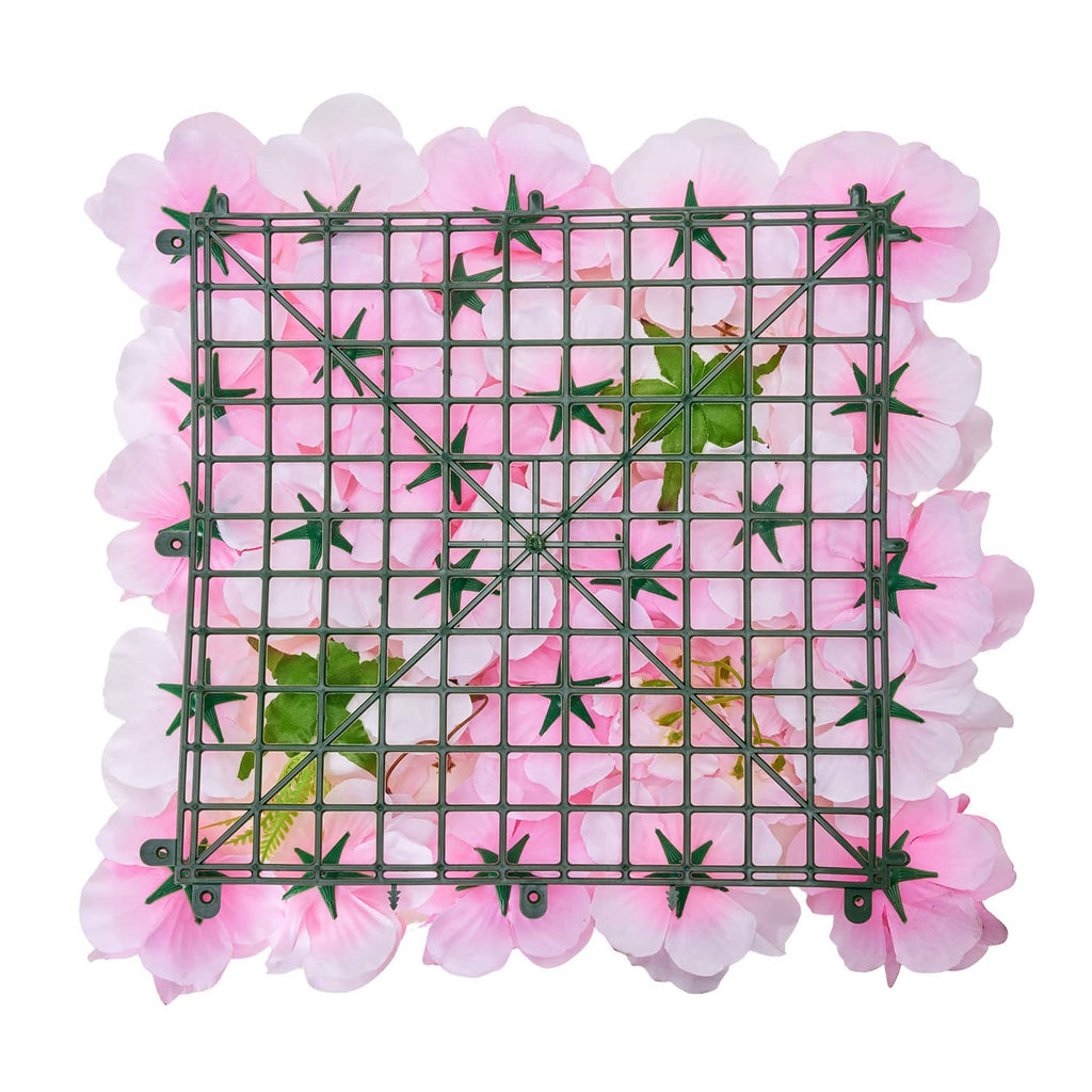 Artificial flower wall panel with black grid and pink flower tiles