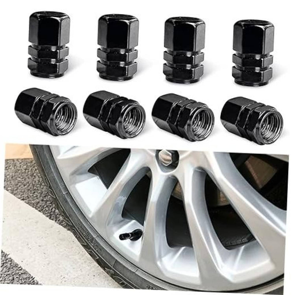 Black aluminum car tire valve stem caps, 8-piece set shown on wheel spokes