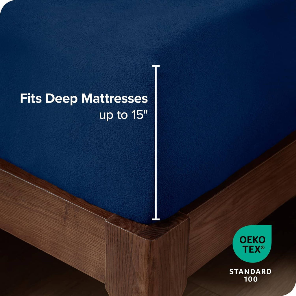 Dark blue fleece fitted sheet corner with snug elastic fit