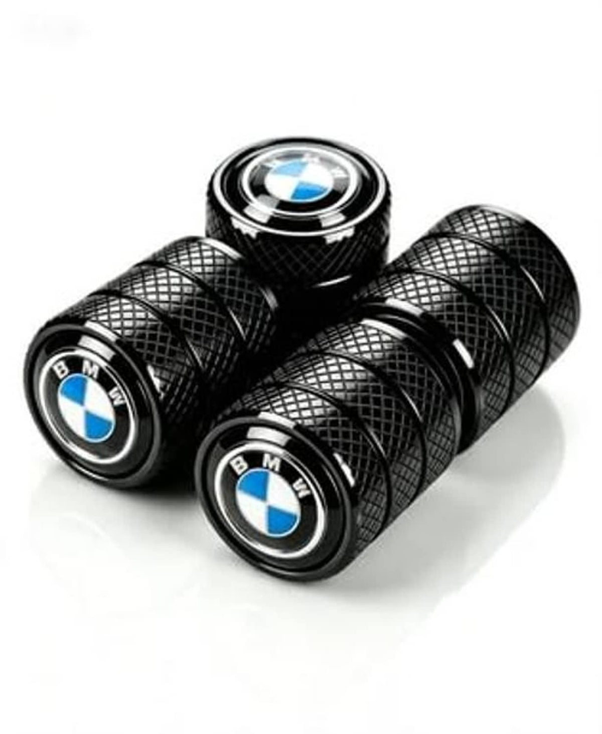 Four black tire valve stem caps with textured pattern and BMW blue-and-white logos