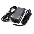Black USB-C laptop power adapter with power plug and coiled cable set