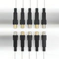 Ten replacement igniter modules with black casings and visible metal electrode contact ends