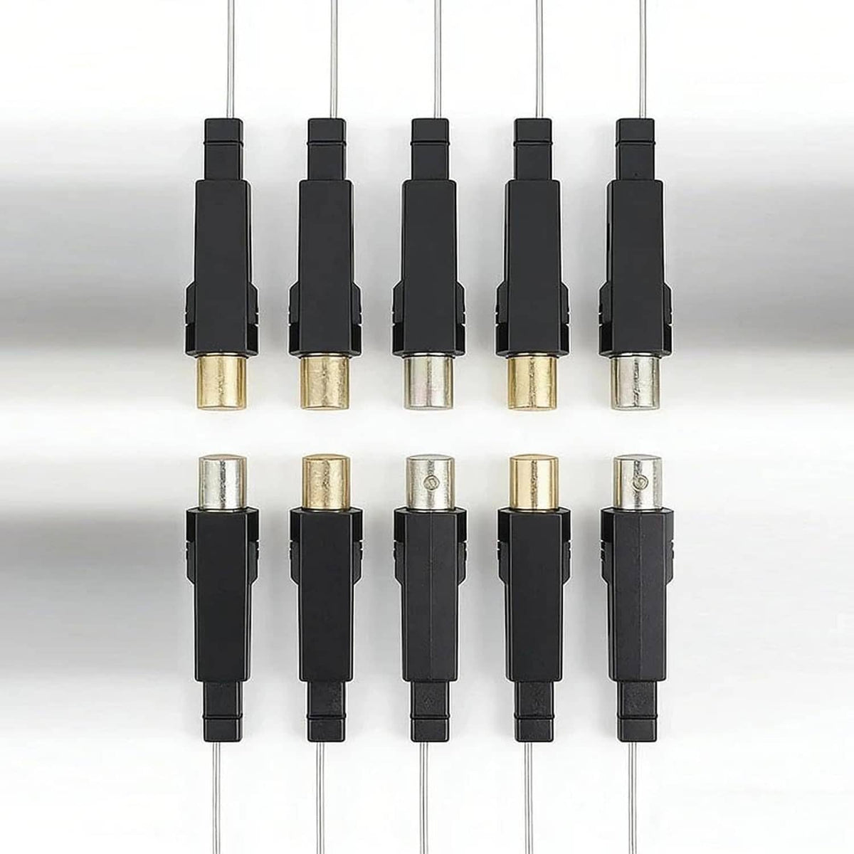 Ten replacement igniter modules with black casings and visible metal electrode contact ends