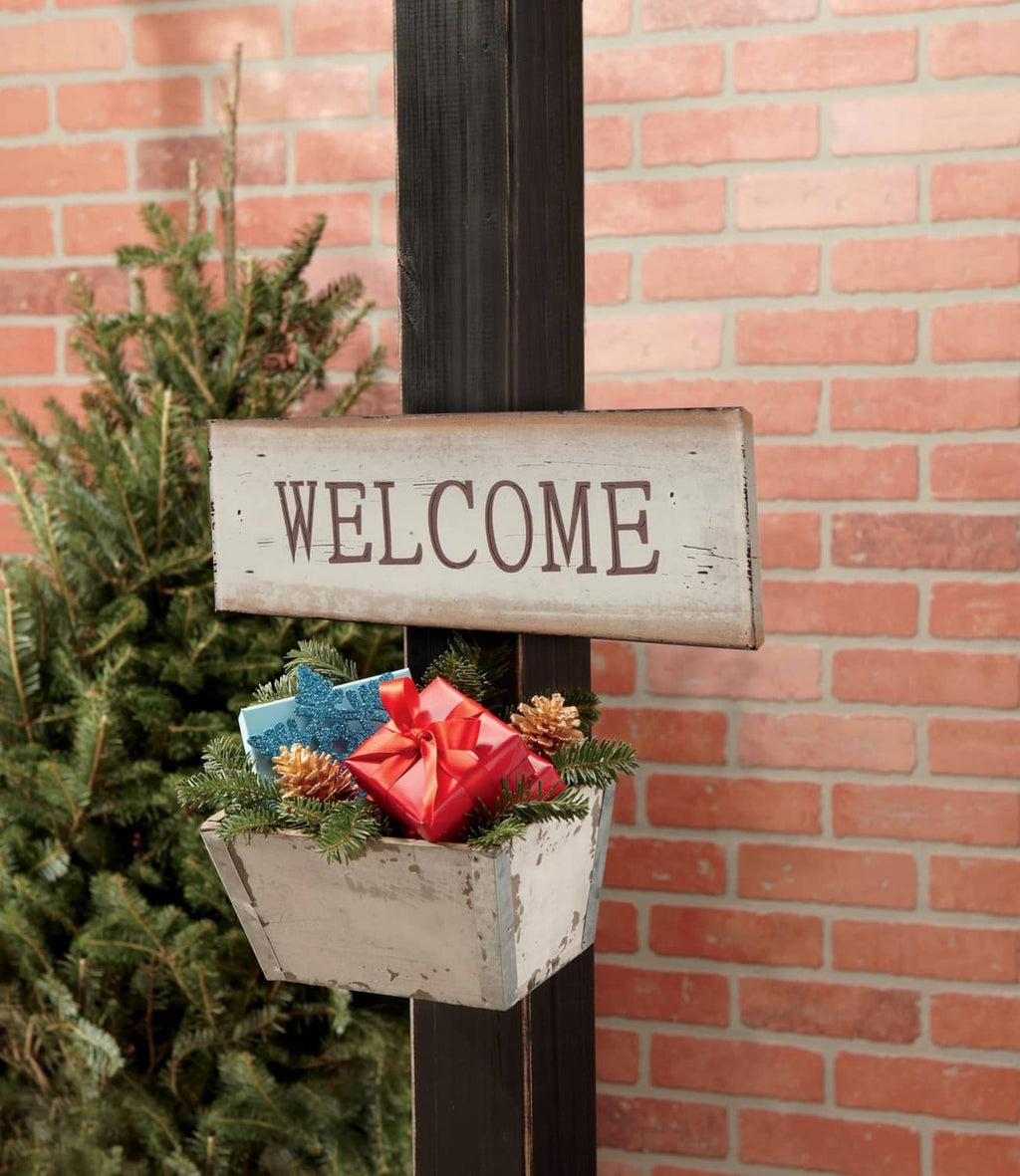 Black interlocking fastener strip attached to a welcome sign display
