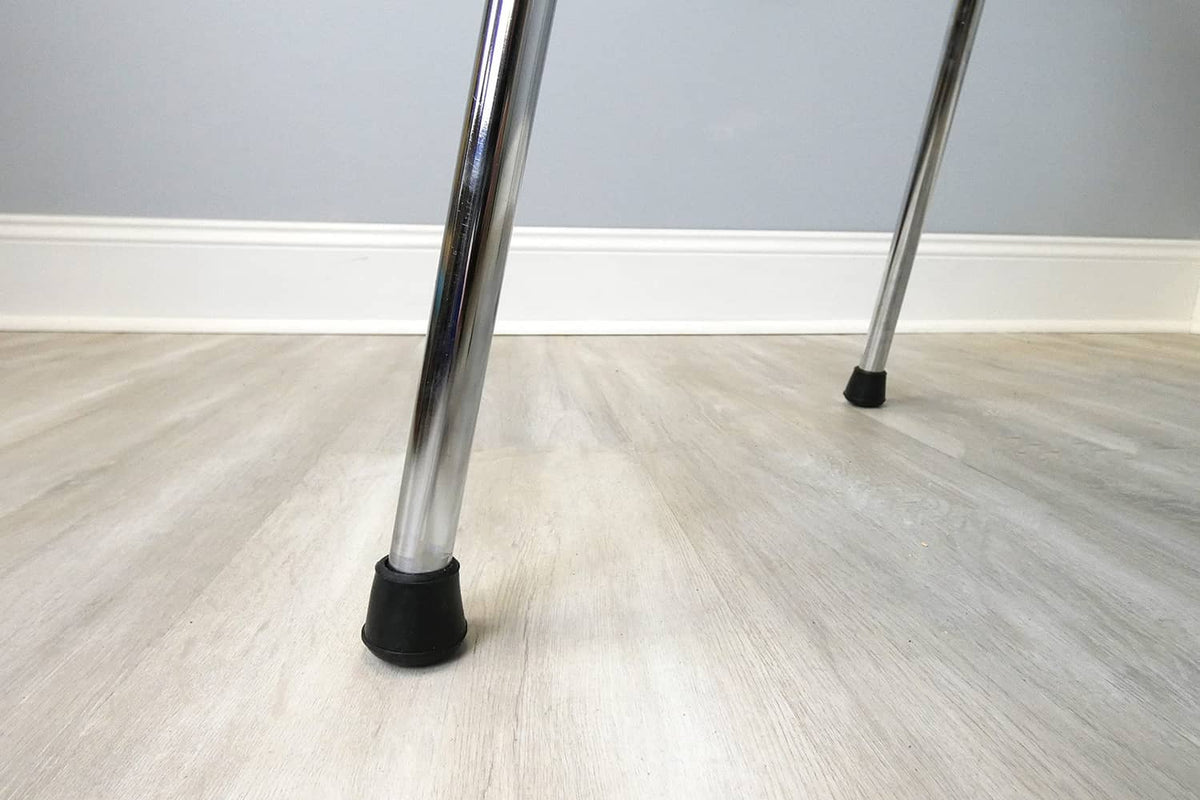 Black rubber chair leg tip on a metal chair leg, 3/4-inch inside diameter
