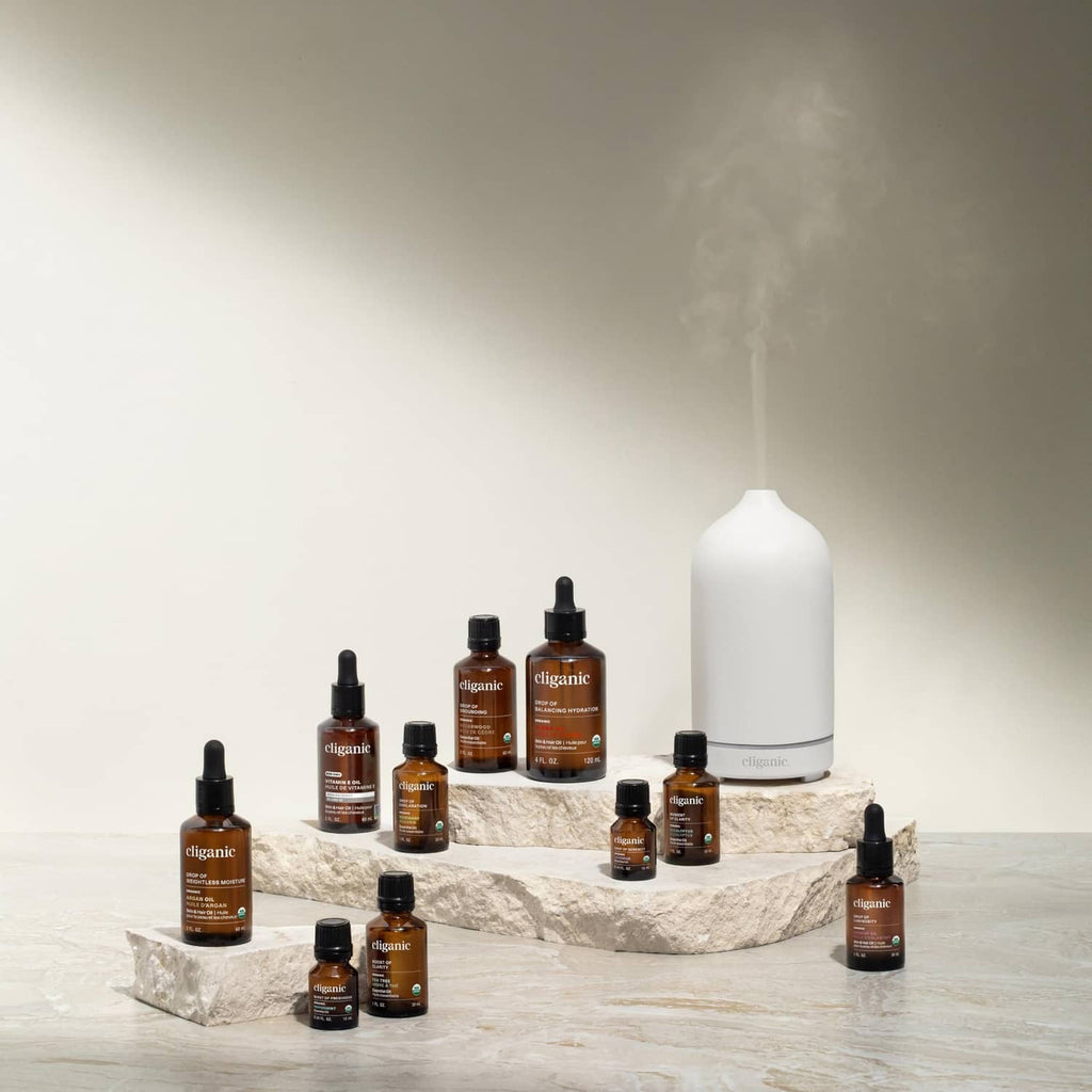 Cliganic argan oil bottles and a large white container with dropper
