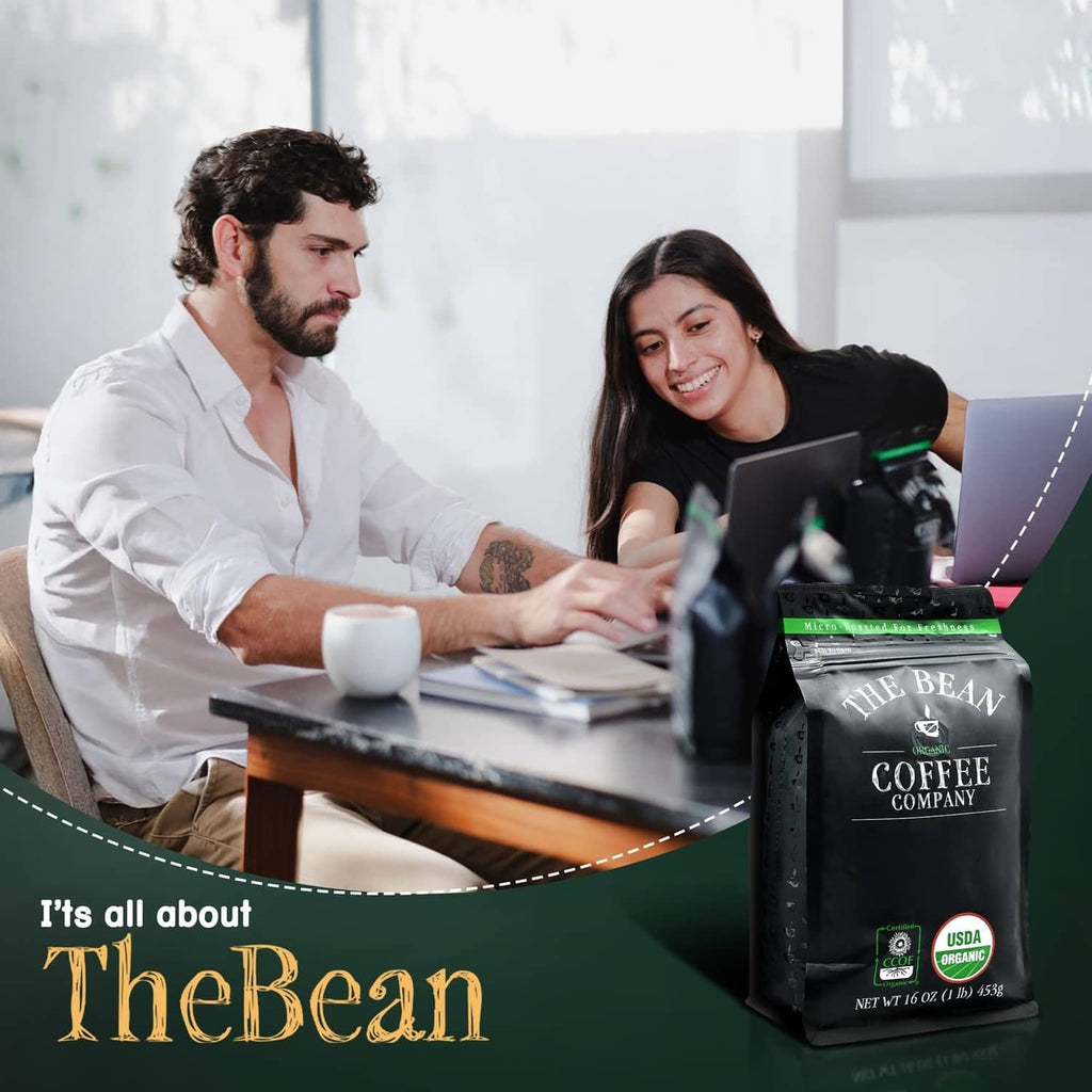 Organic coffee bag on a desk beside a smiling team reviewing documents and coffee