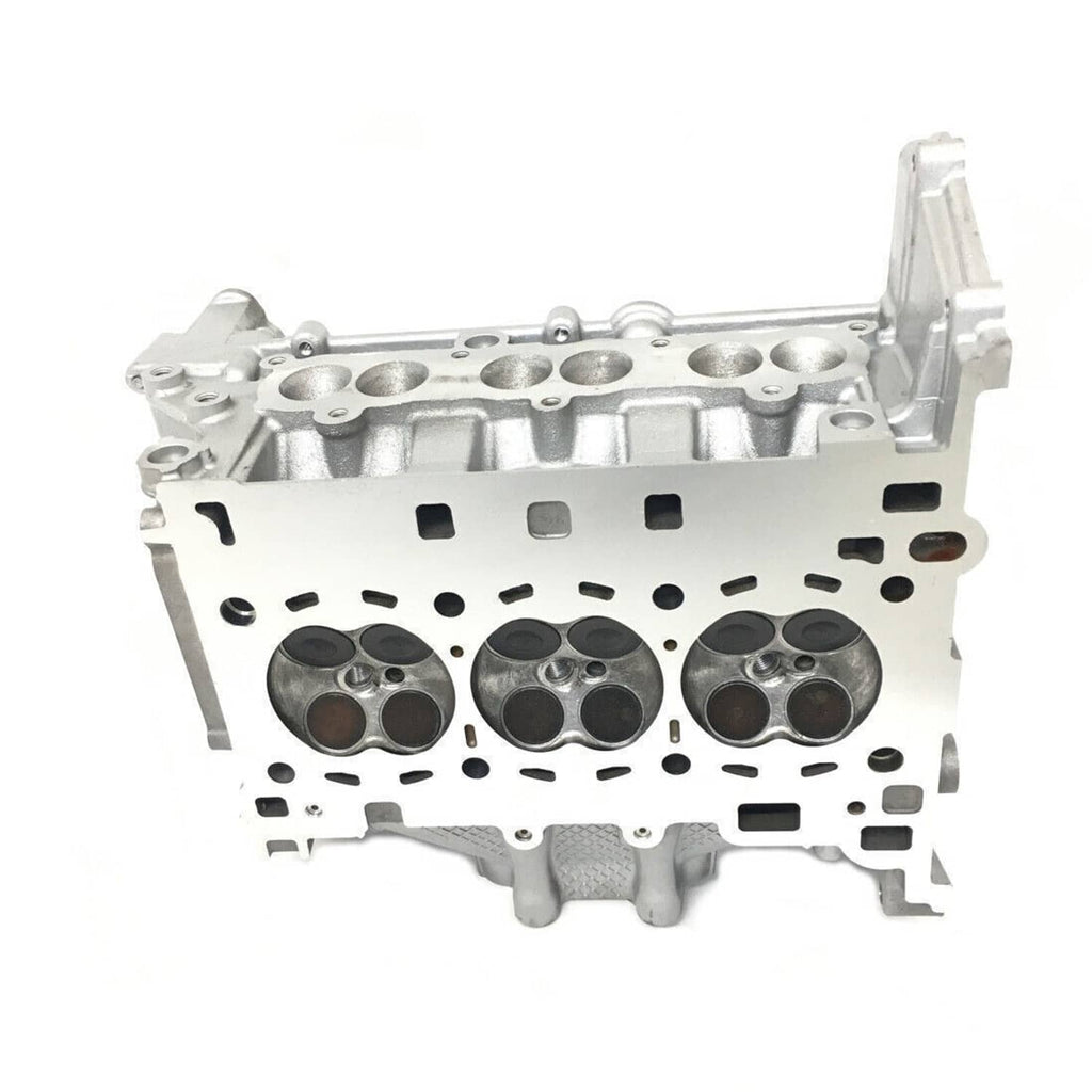 Cylinder head housing with three cylinder bores and internal passages