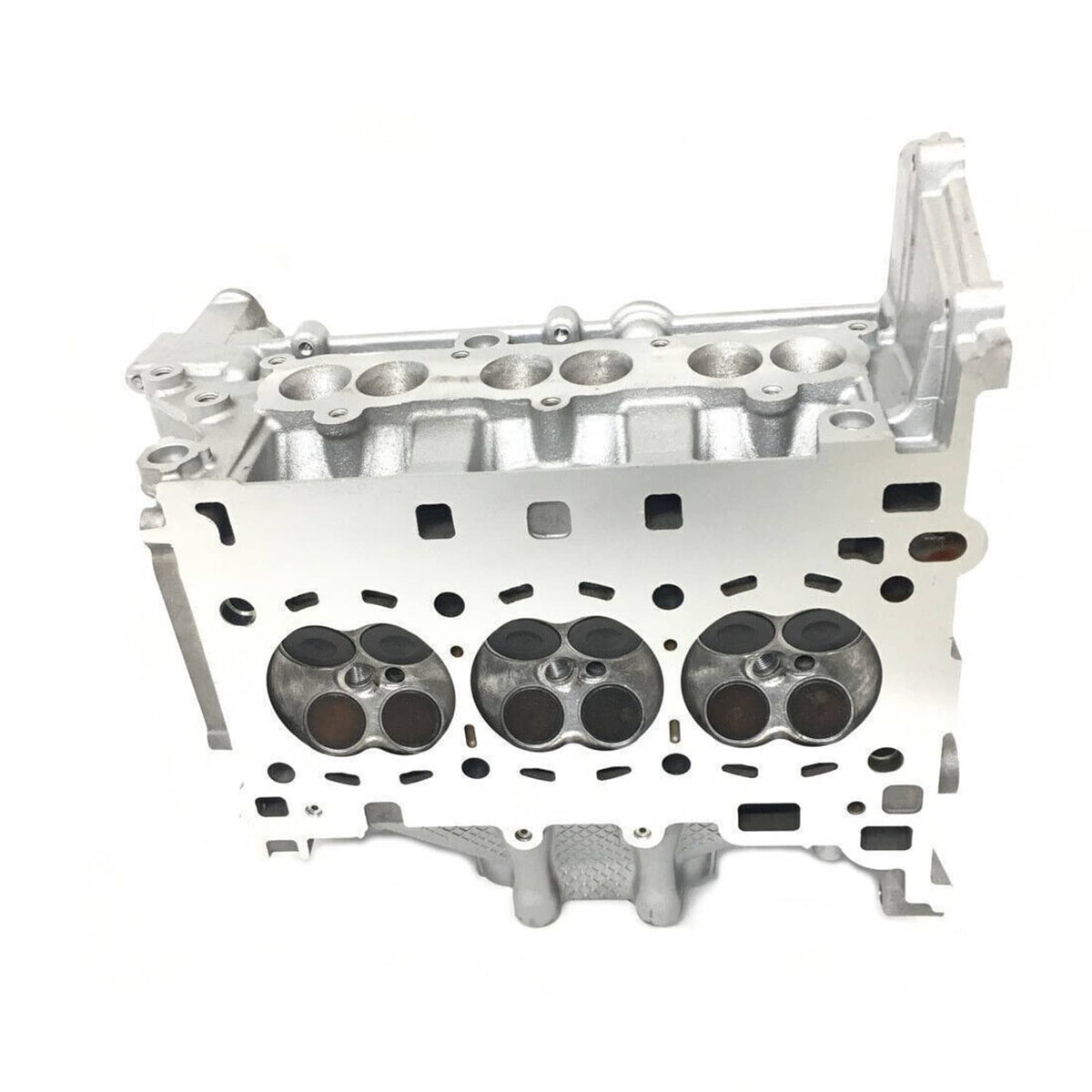 Cylinder head housing with three cylinder bores and internal passages