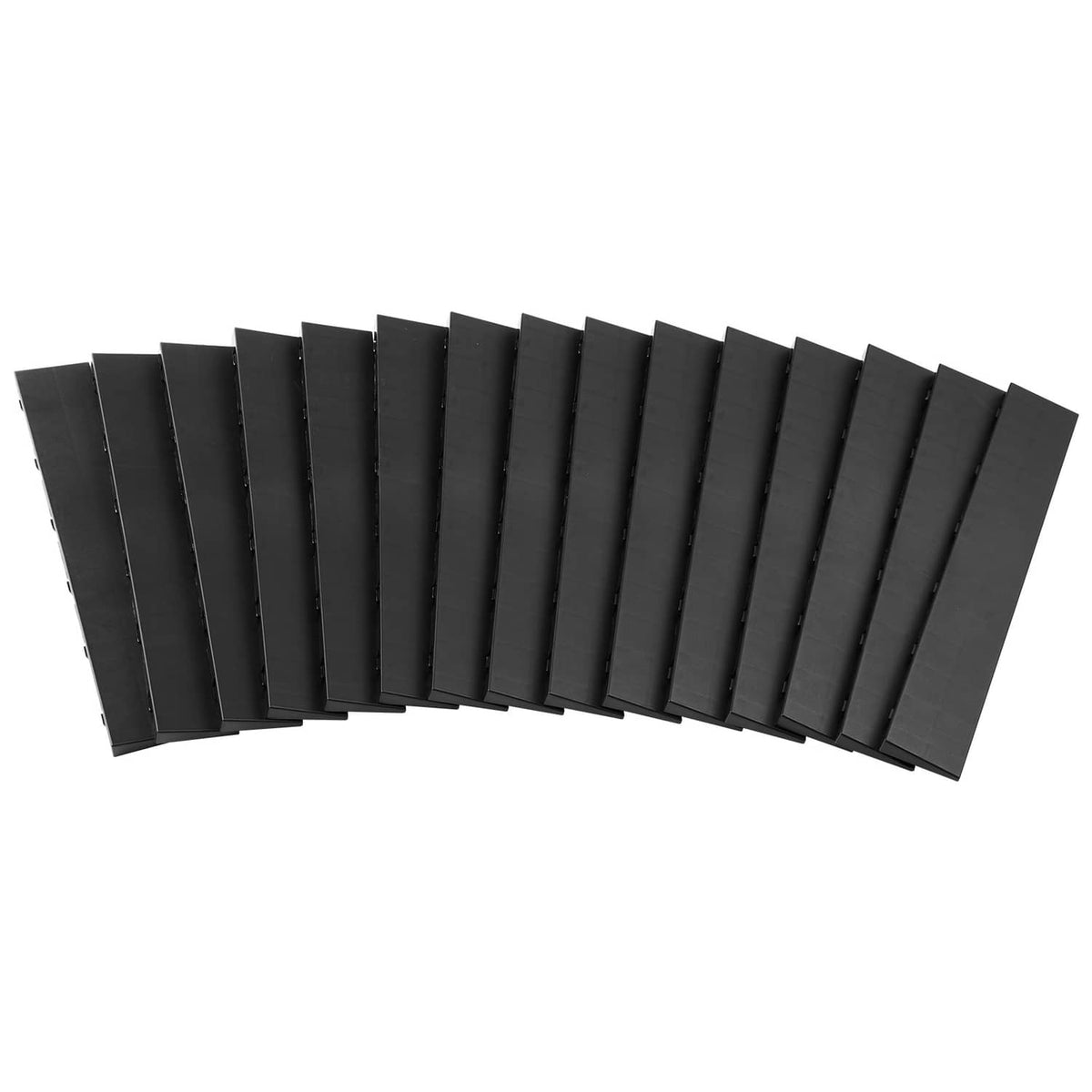 Pack of black interlocking garage floor edge tiles aligned for stacking