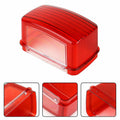 Red tail light lens with ribbed red housing and clear inner section