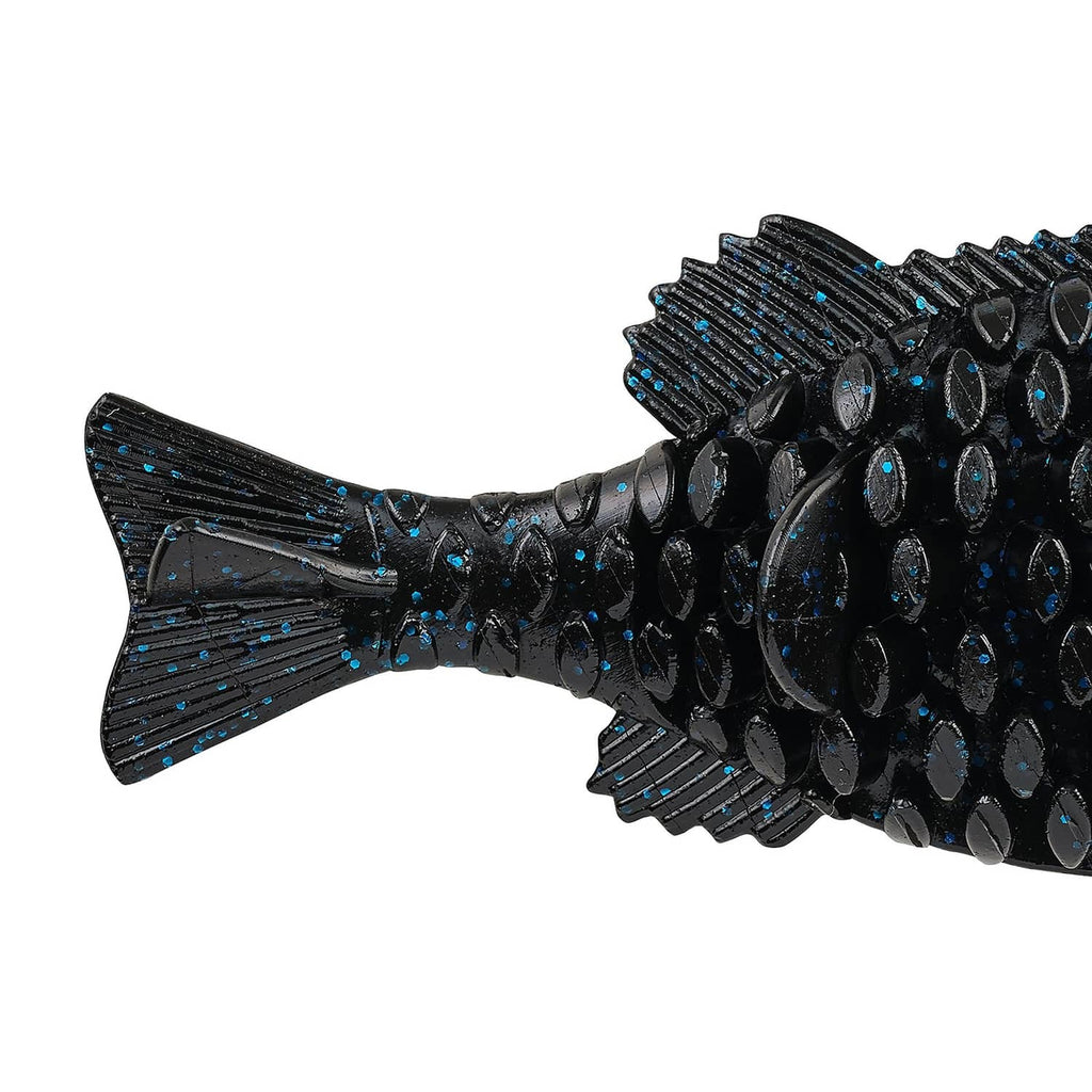 Black soft plastic lure with blue fleck speckles and textured ribbed tail fin.