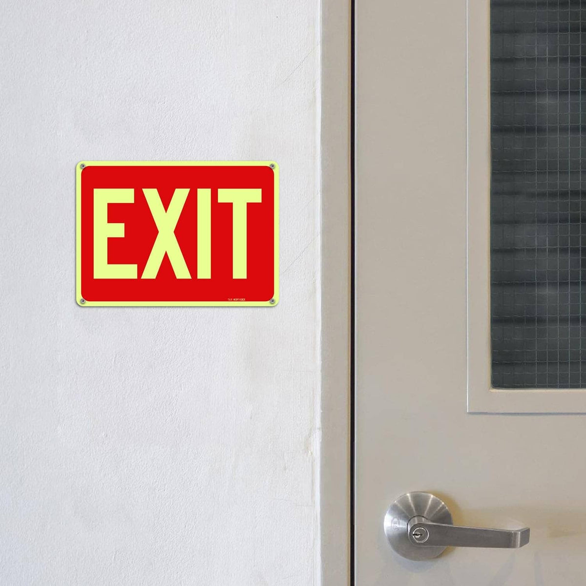Red EXIT sign on wall near door, yellow EXIT letters with green border