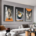Framed wall art set of three abstract shapes in black, white, blue and orange
