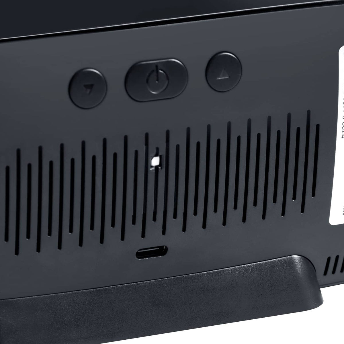 Air quality monitor close-up of top buttons and airflow vent grille